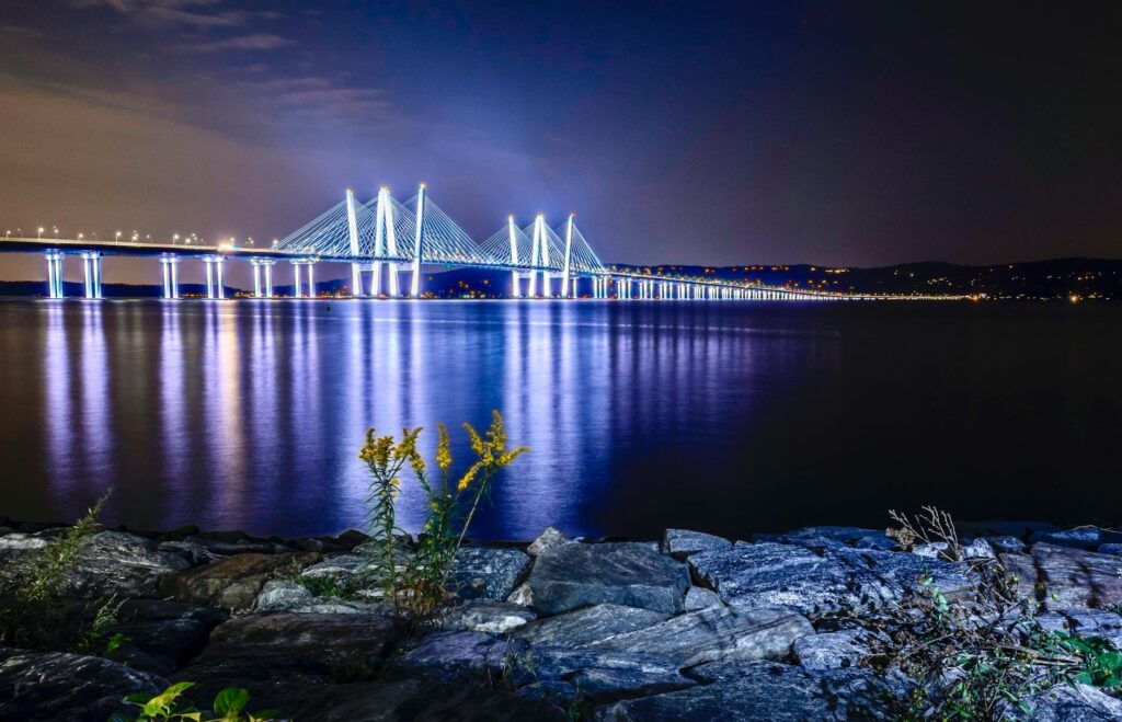 Night view of the Mario Cuomo Bridge in the Hudson Valley, representing regional solar energy