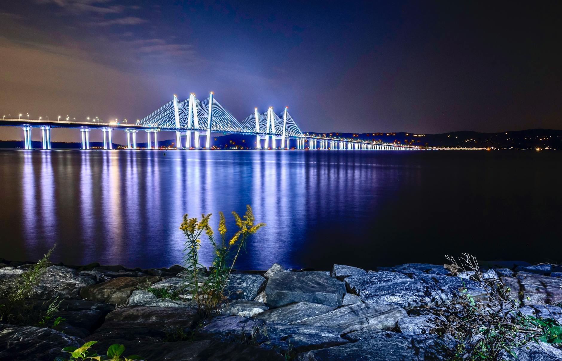 Night view of the Mario Cuomo Bridge in the Hudson Valley, representing regional solar energy