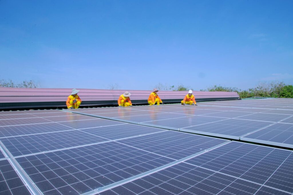 Professional team installing residential solar panels on a roof