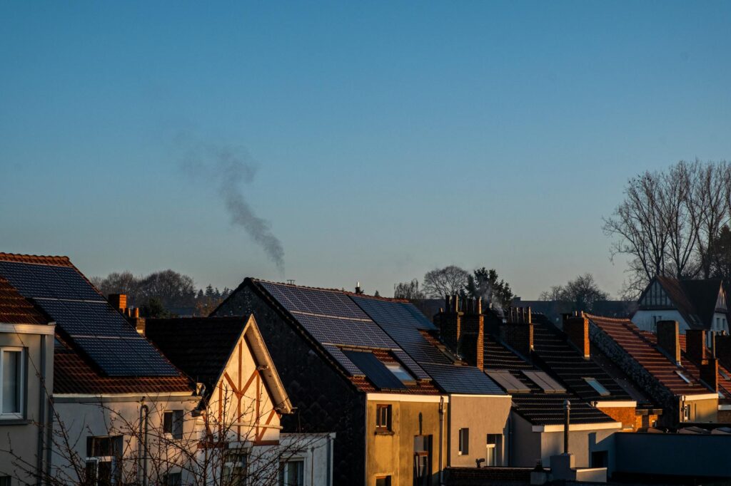 Comparison of rooftop solar panels on a row of residential houses