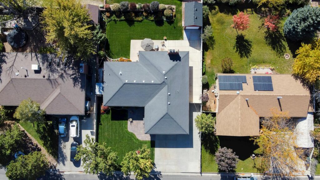 Overhead aerial view of suburban houses to determine if a roof is good for solar panel orientation and shading